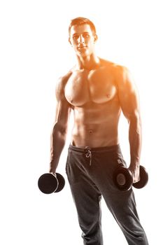 Handsome muscular man doing exercises with dumbbells isolated on white background Whith solar flare