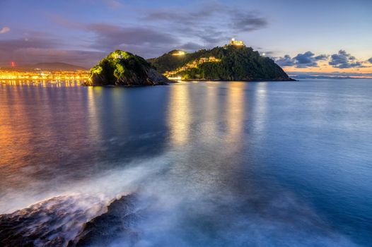 The bay of San Sebastian in Spain with Monte Igueldo after sunset