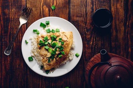 Japanese dish. Rice with scrambled eggs, chicken and green onion