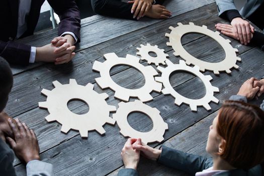 People with gear cogs of business teamwork cooperation concept