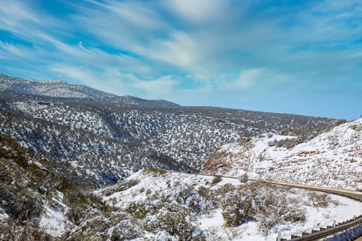 Snowy mountain panorama view in Arizona winter with of Interstate 17 snow clear blue sky.