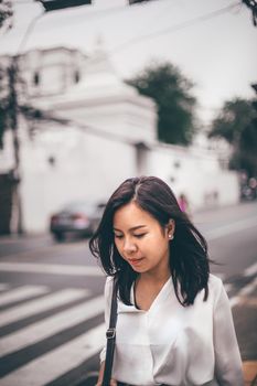 Young Asian beautiful businesswoman walking on street hurry to work