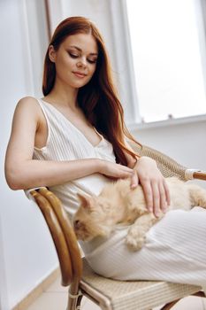 woman hostess with her pet on the terrace outdoor recreation unaltered. High quality photo