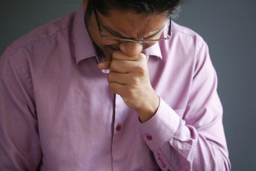 Portrait of sick man sneezes and coughs,