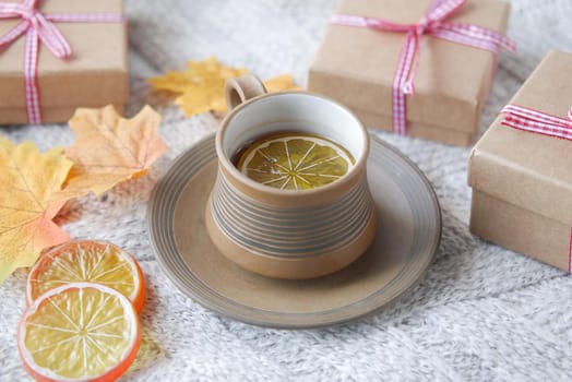 Top view of lemon tea and leaf on table .