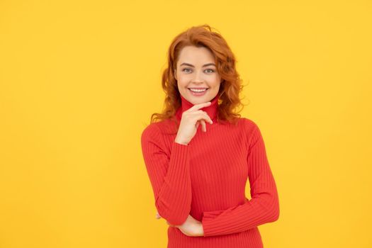 woman face. Close up Portrait of beautiful cheerful redhead girl curly hair smiling laughing looking at camera over yellow background