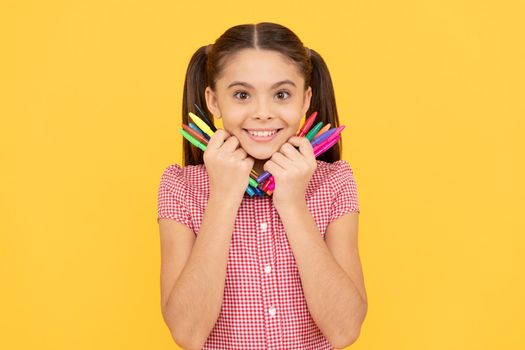 her hobby. creativity. back to school. cheerful teenage girl going to draw picture. child hold colorful pens. smiling kid night like drawing and painting. childhood development and education.