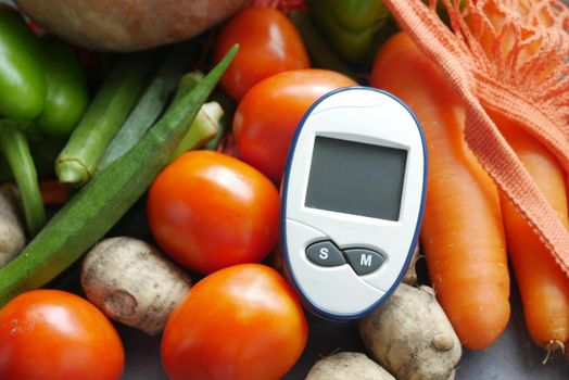 diabetic measurement tools and fresh vegetable on table .