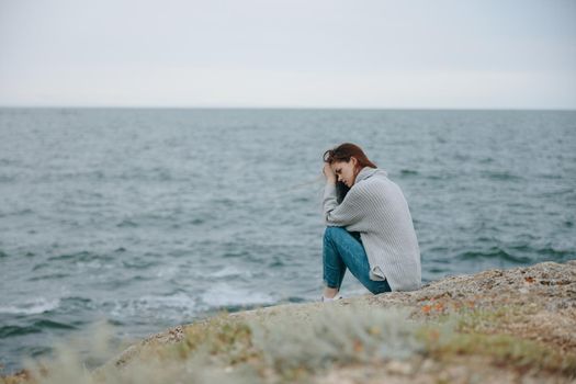 woman long hair nature rocks coast landscape unaltered. High quality photo