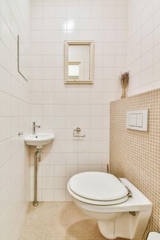 Interior of small clean restroom in miniature style