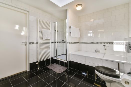 Beautiful bathroom with a bathtub and white walls