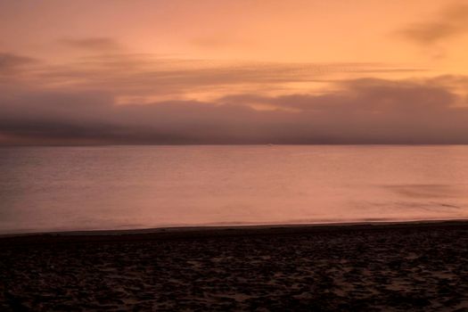 Beautiful Sunrise on the beach in winter in Arenales del Sol, Alicante,southern Spain