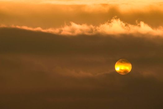 Colorful sun at sunrise over the mediterranean sea in southern Spain in Winter