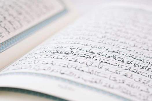 Close up of Holy book Quran on table .