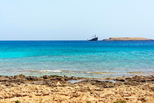 Diakofti port at the Greek island of Kythira. The shipwreck of the Russian boat Norland is in a distance.