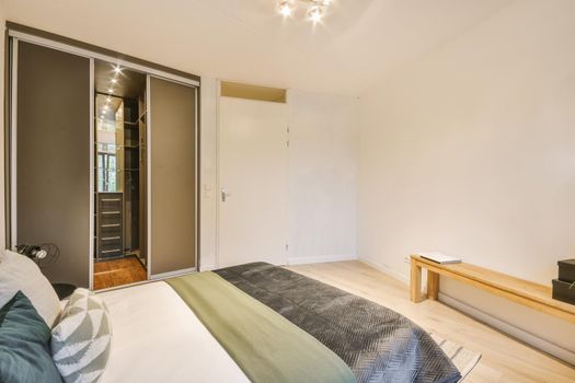 Interior of a cozy and bright bedroom with beautiful decoration