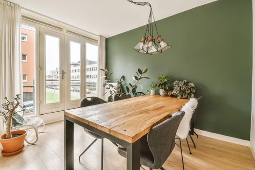 Interior of dining room with stylish table and chairs