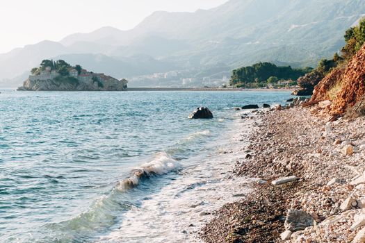 Sveti Stefan island with mountains in the background. High quality photo