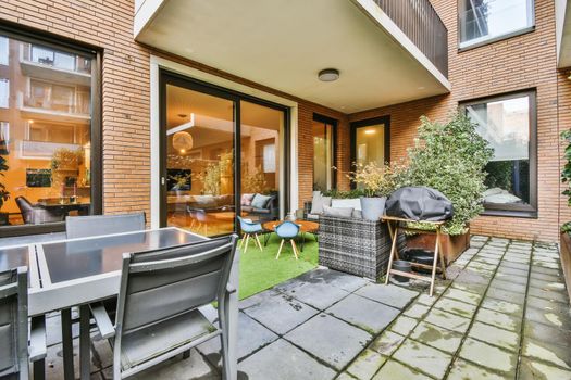 Delightfully beautiful courtyard with greenery and clearly laid cobblestones