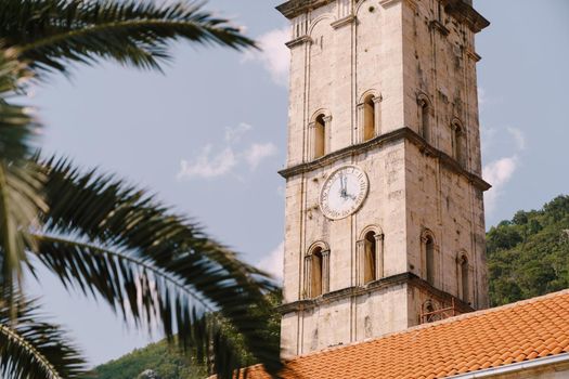 Clock on the bell tower of the Church of St. Nicholas. Montenegro. High quality photo