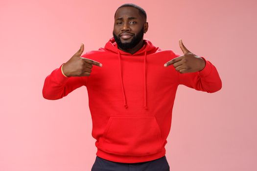 Proud cheeky confident young bearded african american man pointing himself bragging charish praise himself standing spotlight liking be center attention, smirking gladly, pink background.