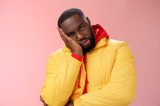 Annoyed bothered pissed african-american bearded man in yellow jacket facepalm look angry camera irritated lean head hand bored fed up pissed hearing uninteresting same stories, pink background.