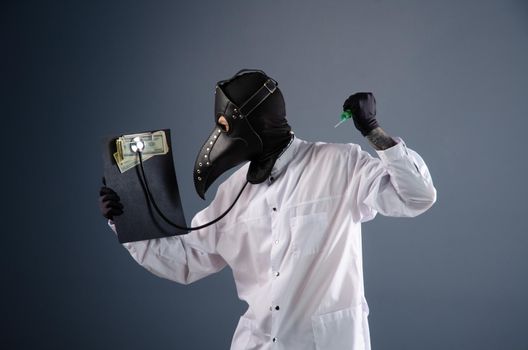 a doctor in a dressing gown, in a plague doctor's mask, is vaccinating