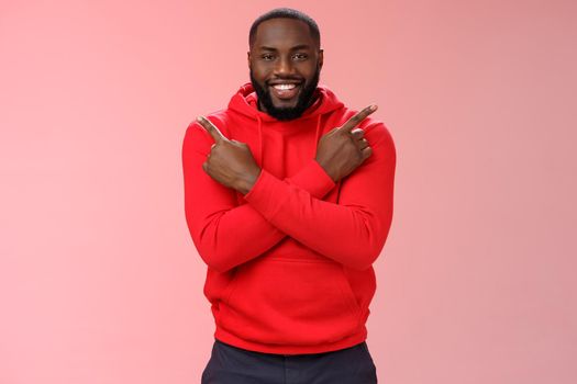 Happy handsome bearded boyfriend pointing different sides cross fingers left right smiling happily asking girlfriend opinion advice what choice make, proposing opportunities variety products.