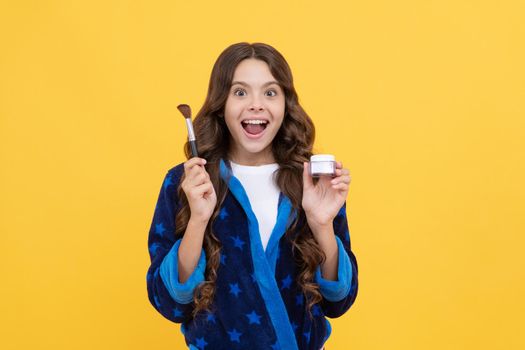 the happiest day ever. morning grooming. natural beauty concept. makeup and skincare. cheerful teenage girl hold powder brush. child in sleepwear use cosmetics. kid cosmetology and beauty.