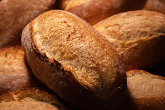 Fresh hot appetizing bread after baking in the oven. Close-up healthy and tasty food.