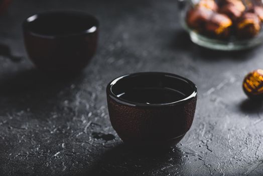 Ready red tea in two tea bowls