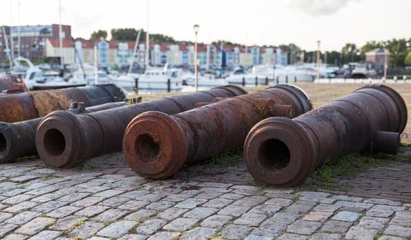 Old Rusty Canons By River At Promenade in Hellevoetlsuis