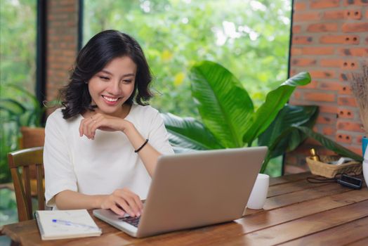 Happy Young Beautiful Woman Using Laptop, Indoors