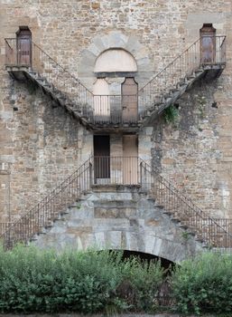 Exterior of antique building with Escher architecture style. Simmetry and geometric perspective.