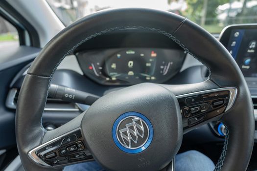 Steering wheel of Electric vehicle Buick VeLite 6 on streets of Kyiv, near EV charging station. General Motors family next generation electric car based on Chevrolet Bolt technology . 17th of june 2021 Kyiv, Ukraine,. High quality photo