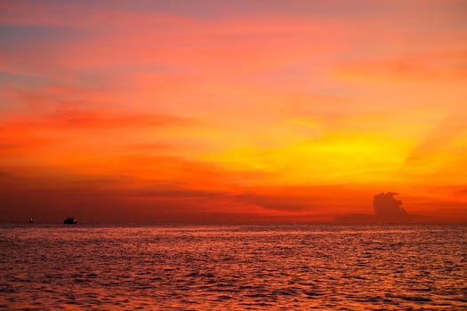 Red and orange sky during sunset on the sea and look beautiful landscape on holiday.