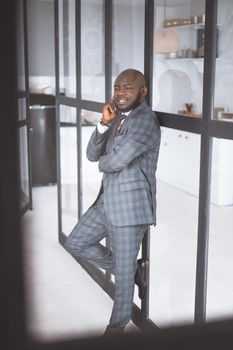 Happy Middle Age Man. Pensive Guy In Suit Smiles. African American Dude Became Thoughtful. High quality photo