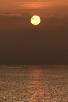 Colorful sun at sunrise over the mediterranean sea in southern Spain in Winter