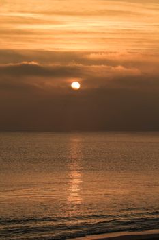 Colorful sun at sunrise over the mediterranean sea in southern Spain in Winter