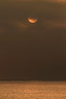 Colorful sun at sunrise over the mediterranean sea in southern Spain in Winter