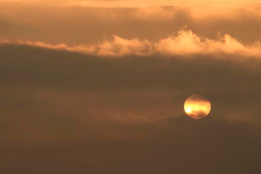 Colorful sun at sunrise over the mediterranean sea in southern Spain in Winter