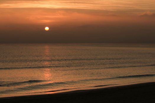Beautiful Sunrise on the beach in winter in Arenales del Sol, Alicante,southern Spain