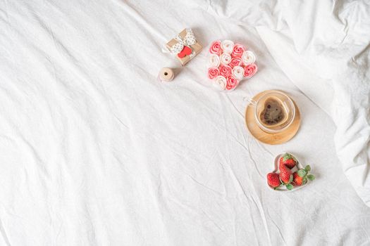 Spring, summer still life composition for valentine day. Blank greeting card mockup scene with heart shaped cup of coffee, strawberries, and roses flowers. Breakfast in bed. Flat lay, top view