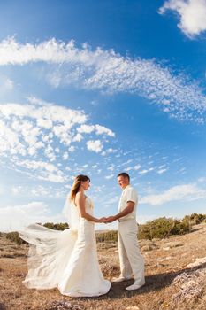 Portrait of happy bride and groom outdoor in nature location. Summer or autumn season.