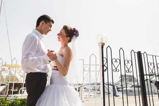 Young loving couple kissing on the beach