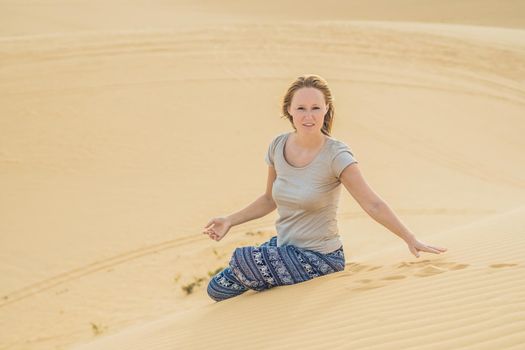 Young woman in the desert, Mui Ne, Vietnam