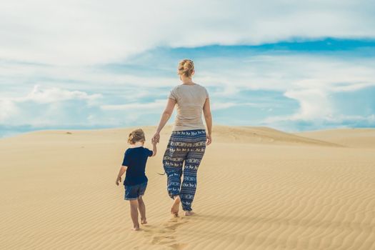 Mom and son in the desert. Traveling with children concept.