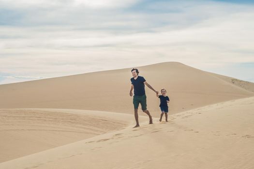 Father and son at the white desert. Traveling with children concept.