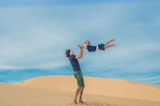 Father and son at the white desert. Traveling with children concept.