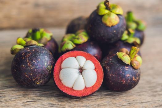 Mangosteen fruit on old wooden table. Tropical Fruits.